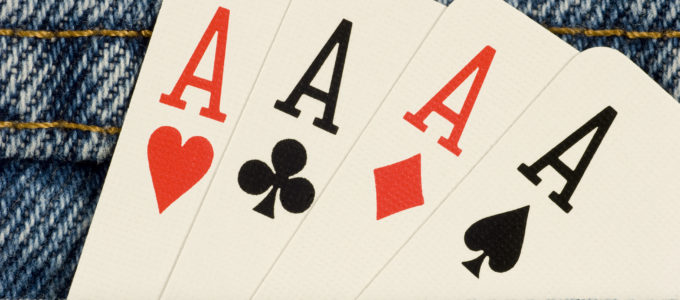 Four aces in a denim pocket